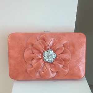 Elegant Coral Clutch with Floral Accent